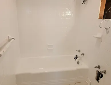 a white bathtub in a bathroom