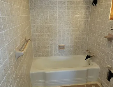 a white bathtub in a bathroom
